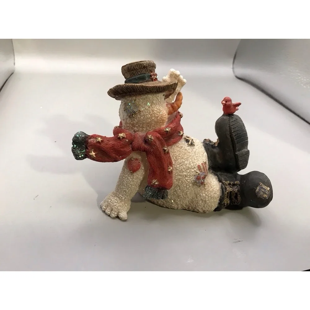 Resin Snowman Kicked‎ Back With A Bird On His Foot
